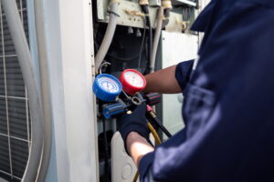 commercial HVAC maintenance technician checking commercial system.